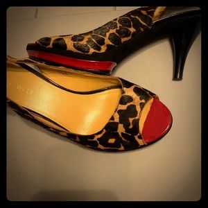 Nine West heels. Red bottom with leapard print.